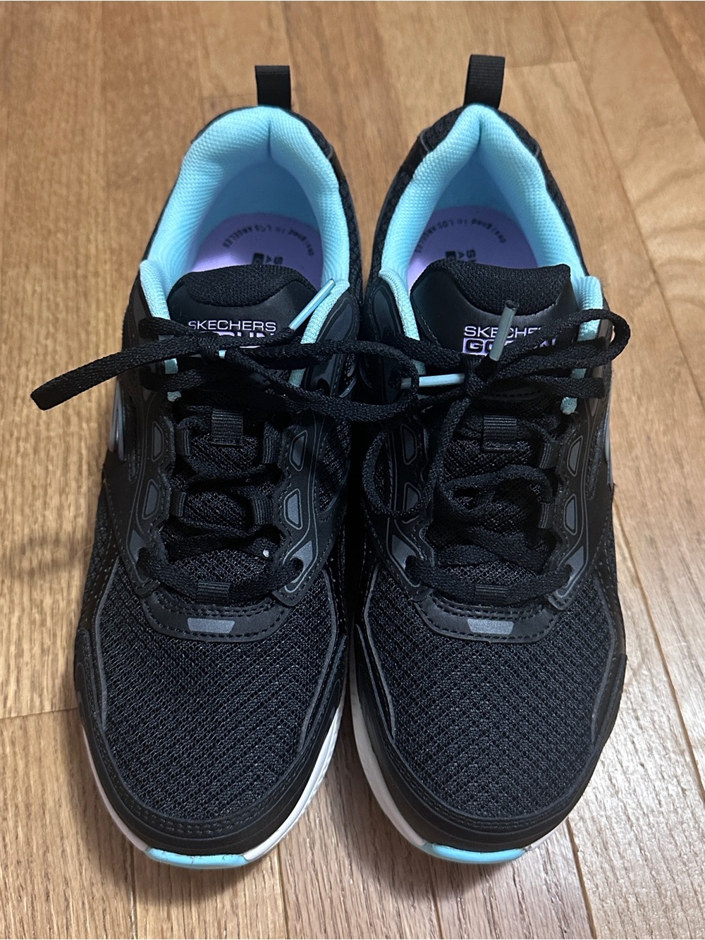 Skechers Women's Black Athletic Sneakers with Light Blue Lining